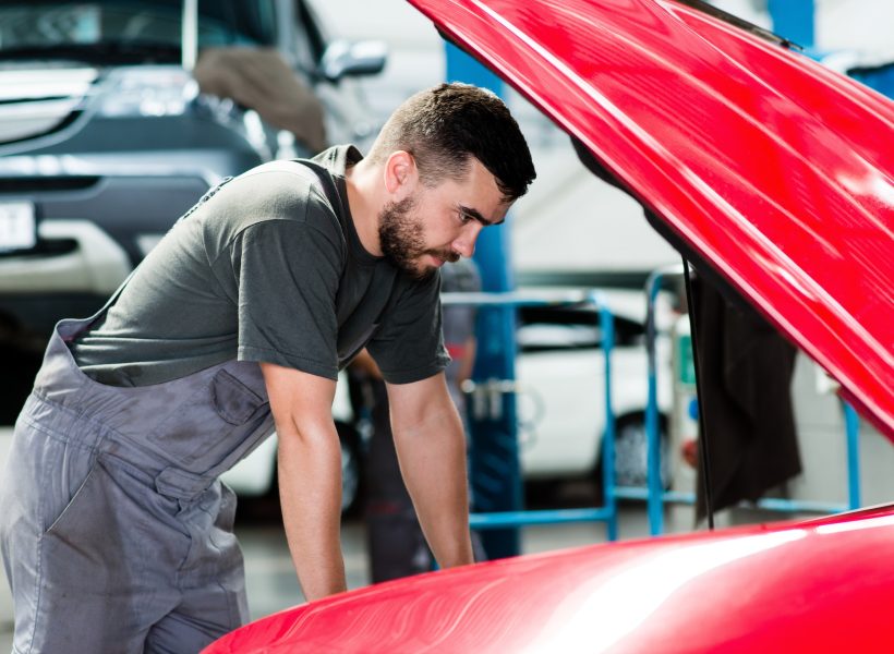 auto-mechanic-working-in-garage-repair-service-looking-at-the-car-s-motor-image.jpg
